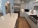 Beautiful kitchen featuring gray cabinets, stainless steel appliances, and a large center island at 2460 Collins Dr, Westfield, IN 46074