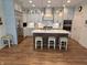 Modern kitchen with gray cabinets, stainless steel appliances, and a large center island at 2460 Collins Dr, Westfield, IN 46074