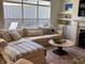 Bright living room featuring a comfortable sofa, a fireplace, and built-in shelving at 2460 Collins Dr, Westfield, IN 46074