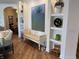 Bright living room with hardwood floors, decorative shelving and a cozy accent bench at 2460 Collins Dr, Westfield, IN 46074