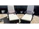 Elegant lounge chairs on a brick patio, providing a comfortable outdoor seating area with plush cushions at 2460 Collins Dr, Westfield, IN 46074