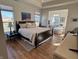 Bright main bedroom with a tray ceiling, a sitting area, and beautiful views at 2460 Collins Dr, Westfield, IN 46074