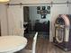 Home office with sliding barn doors, a vintage jukebox and a patterned rug at 2460 Collins Dr, Westfield, IN 46074