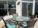 Outdoor patio with a round glass-top table and four cushioned chairs, perfect for enjoying outdoor meals at 2460 Collins Dr, Westfield, IN 46074