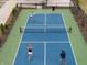 Outdoor pickleball court available within the community with a smooth surface and complete fencing at 2460 Collins Dr, Westfield, IN 46074