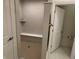 Well-designed shower with a bench, a shelf, and modern tile work at 2460 Collins Dr, Westfield, IN 46074