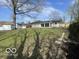 Expansive backyard with grass, shed, and single-Gathering home at 2750 Kristen E Dr, Indianapolis, IN 46218