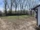 Large backyard with a swing set and privacy fence at 2750 Kristen E Dr, Indianapolis, IN 46218