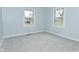 Bright bedroom featuring neutral walls, gray carpeting, and double windows at 2750 Kristen E Dr, Indianapolis, IN 46218