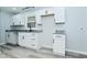 Bright kitchen with sleek white cabinetry, granite countertops, and modern hardware at 2750 Kristen E Dr, Indianapolis, IN 46218