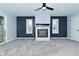 Bright living room with a fireplace, blue accent wall, and neutral gray carpet at 2750 Kristen E Dr, Indianapolis, IN 46218