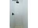 Modern white shower with black fixtures and elegant herringbone tile design at 2750 Kristen E Dr, Indianapolis, IN 46218
