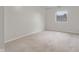 This bedroom features neutral carpeting and a large window at 2770 Two Worlds Dr, Columbus, IN 47201