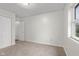Neutral bedroom features carpeted floors, ample closet space, a window, and neutral paint at 2770 Two Worlds Dr, Columbus, IN 47201
