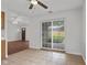 Dining area featuring sliding glass doors and tile floor at 2770 Two Worlds Dr, Columbus, IN 47201