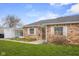 Lovely single-story brick home with well-kept lawn and a practical carport at 2770 Two Worlds Dr, Columbus, IN 47201