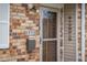 Close up of a brick house's entrance with a mailbox and 'welcome' sign at 2770 Two Worlds Dr, Columbus, IN 47201
