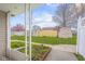 Home's front yard features an ornate railing and a mature blossoming tree in the distance at 2770 Two Worlds Dr, Columbus, IN 47201