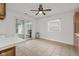 Bright kitchen with tile floors, stainless steel trash can, and sliding door to the outside at 2770 Two Worlds Dr, Columbus, IN 47201