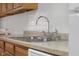 Close-up of kitchen sink with stainless steel faucet and white backsplash at 2770 Two Worlds Dr, Columbus, IN 47201