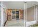 Spacious covered back patio with privacy fence and slider access to the interior of the home at 2770 Two Worlds Dr, Columbus, IN 47201