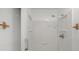 All white shower features sleek design and shower head at 2770 Two Worlds Dr, Columbus, IN 47201