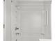 All-white shower features modern fixtures and shower head, and a built-in shelf at 2770 Two Worlds Dr, Columbus, IN 47201