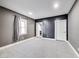 Spacious bedroom with neutral carpet, grey walls, and bright white trim at 3006 W 10Th St, Indianapolis, IN 46222