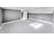 Attic bedroom with an open door and gray walls and carpet at 3006 W 10Th St, Indianapolis, IN 46222