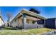 Charming home with covered porch and wood siding, presenting a welcoming facade at 3006 W 10Th St, Indianapolis, IN 46222