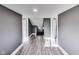Hallway view shows a hallway with two doorways and new floors at 3006 W 10Th St, Indianapolis, IN 46222