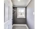 Inside a simple walk-in closet featuring a window and a clothes rod at 3006 W 10Th St, Indianapolis, IN 46222
