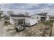 Aerial view of backyard with trailer and detached garage with an open carport at 319 Alice St, Shelbyville, IN 46176