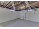 Unfinished basement featuring painted walls and ceiling, and windows at 319 Alice St, Shelbyville, IN 46176