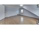 Cozy bedroom featuring hardwood floors, neutral walls, and natural light from a window at 319 Alice St, Shelbyville, IN 46176