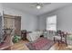 Bright bedroom with natural light, featuring hardwood floors, a ceiling fan, and neutral decor creating a relaxing ambiance at 319 Alice St, Shelbyville, IN 46176