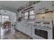 Well-lit kitchen with vintage decor and white cabinetry, complemented by a view into the dining area at 319 Alice St, Shelbyville, IN 46176