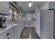 Efficient kitchen with white appliances and cabinetry with a connecting door to the back yard at 319 Alice St, Shelbyville, IN 46176
