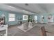 Bright living room with bright teal walls and lots of vintage touches at 319 Alice St, Shelbyville, IN 46176