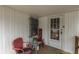 Covered porch features decor, chair and access to the home at 319 Alice St, Shelbyville, IN 46176