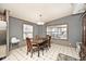 Comfortable dining room features wood floors, a window, and an adjacent kitchen at 33 W Mill St, New Palestine, IN 46163