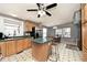 Eat-in kitchen features wood cabinets, stainless steel appliances and a center island with bar seating at 33 W Mill St, New Palestine, IN 46163