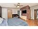 Main bedroom features a brick accent wall and updated floors and finishes at 33 W Mill St, New Palestine, IN 46163