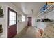 Storage room with shelving, ample space, and access to the exterior of the home at 33 W Mill St, New Palestine, IN 46163
