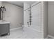 Bright bathroom featuring subway tile, a tub, toilet, and a vanity with modern fixtures at 3447 Washington Blvd, Indianapolis, IN 46205