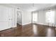Bedroom with hardwood floors, two windows, and two closets at 3447 Washington Blvd, Indianapolis, IN 46205