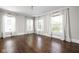 Spacious bedroom with hardwood floors, three large windows providing lots of natural light at 3447 Washington Blvd, Indianapolis, IN 46205