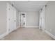 Bright bedroom with neutral carpet and large windows, perfect for relaxation and rest at 3447 Washington Blvd, Indianapolis, IN 46205