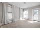 Light-filled bedroom with carpet and several windows, creating a warm and inviting space at 3447 Washington Blvd, Indianapolis, IN 46205