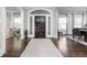 Elegant foyer features hardwood floors, arched doorway, and natural light, creating a welcoming and grand entrance at 3447 Washington Blvd, Indianapolis, IN 46205